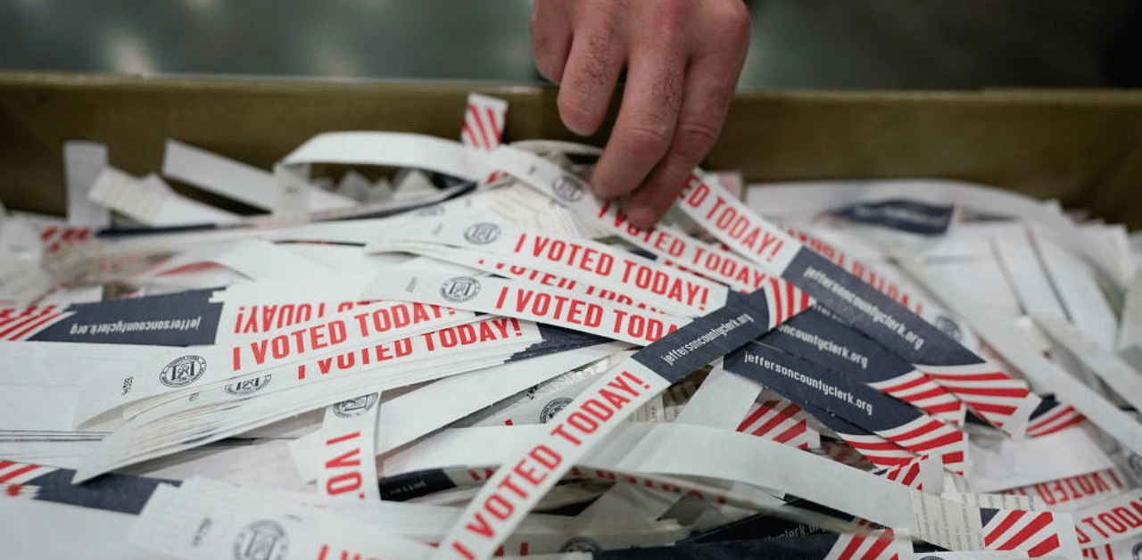 A voter takes a "I voted today" badge at the Kentucky Exposition Center during the election in Louisville, Kentucky, U.S. November 3, 2020. Credit: Reuters Photo