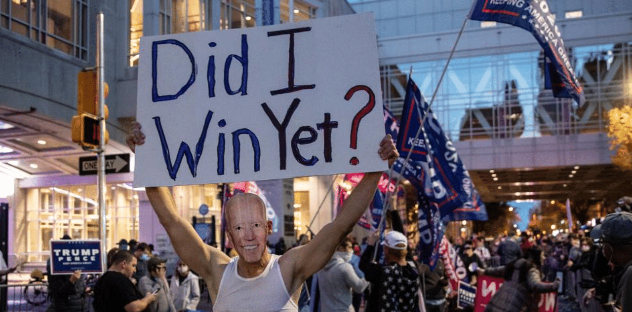 Supporters of U.S. President Donald Trump hold signs and chant slogans during a protest outside the Philadelphia Convention Center as votes continue to be counted following the 2020 U.S. presidential election on November 5, 2020 in Philadelphia, Pennsylvania. Credit: AFP Photo