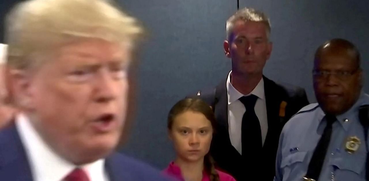 Swedish environmental activist Greta Thunberg watches as U.S. President Donald Trump enters the United Nations to speak with reporters in a still image from video taken in New York City, U.S. September 23, 2019. Credit: Reuters Photo