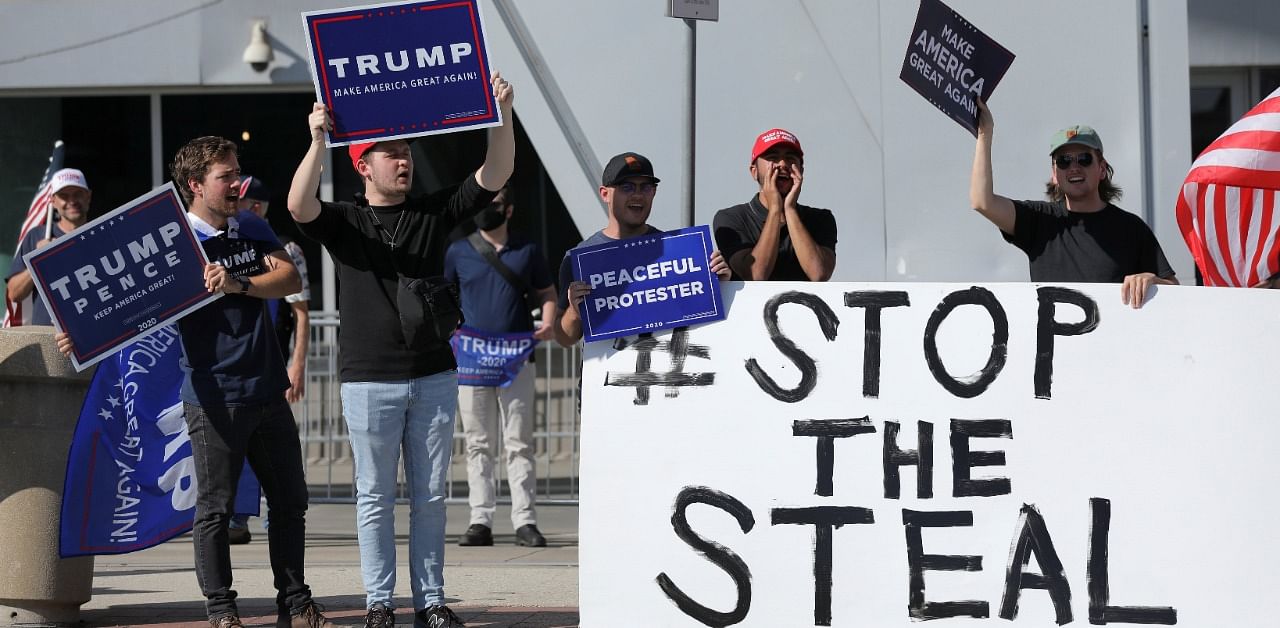 Supporters of US President Donald Trump gather outside the State Farm Arena as votes continue to be counted following the 2020 US presidential election, in Atlanta, Georgia. Credit: Reuters Photo
