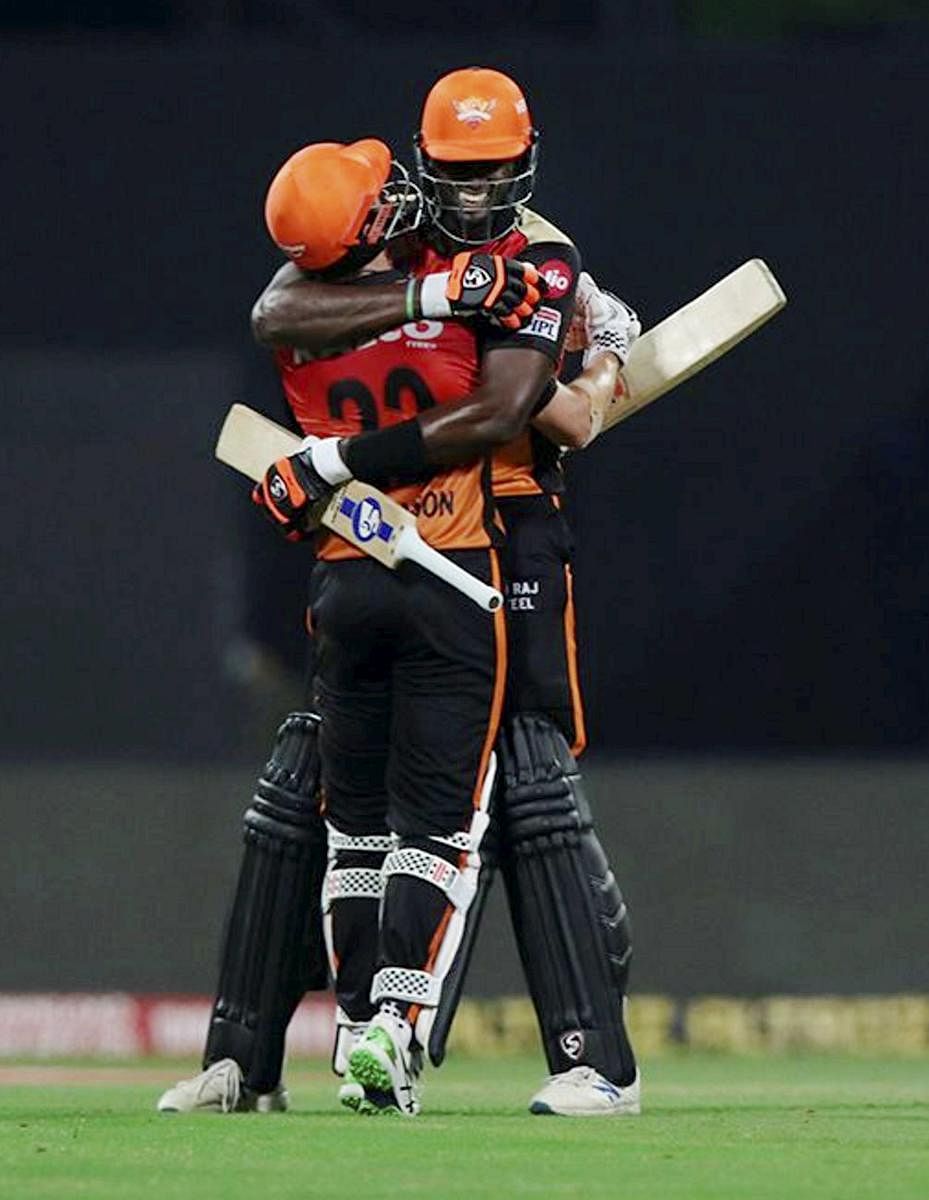 Jason Holder (right) and Kane Williamson celebrate after guiding Sunrisers Hyderabad to six-wicket win over Royal Challengers Bangalore in the Eliminator on Friday. Sportzpics