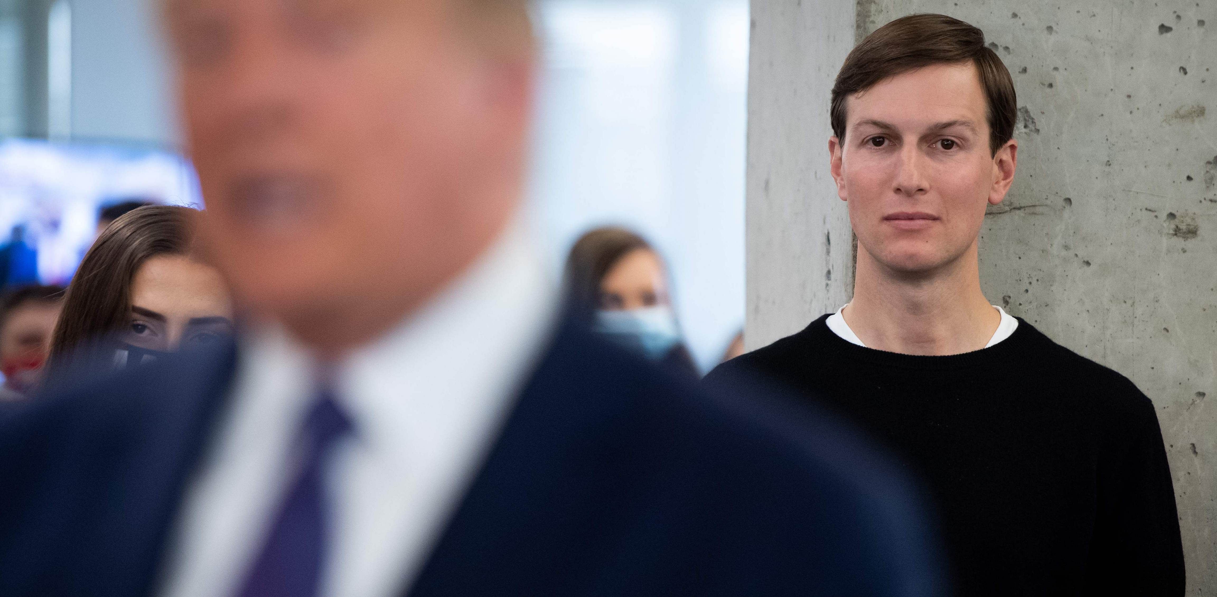 White House Senior Advisor Jared Kushner listens to President Donald Trump at his Virginia campaign headquarters. Credit: AFP Photo