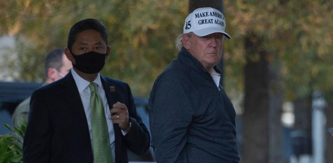 US President Donald Trump returns to White House after playing golf. Credit: AFP Photo