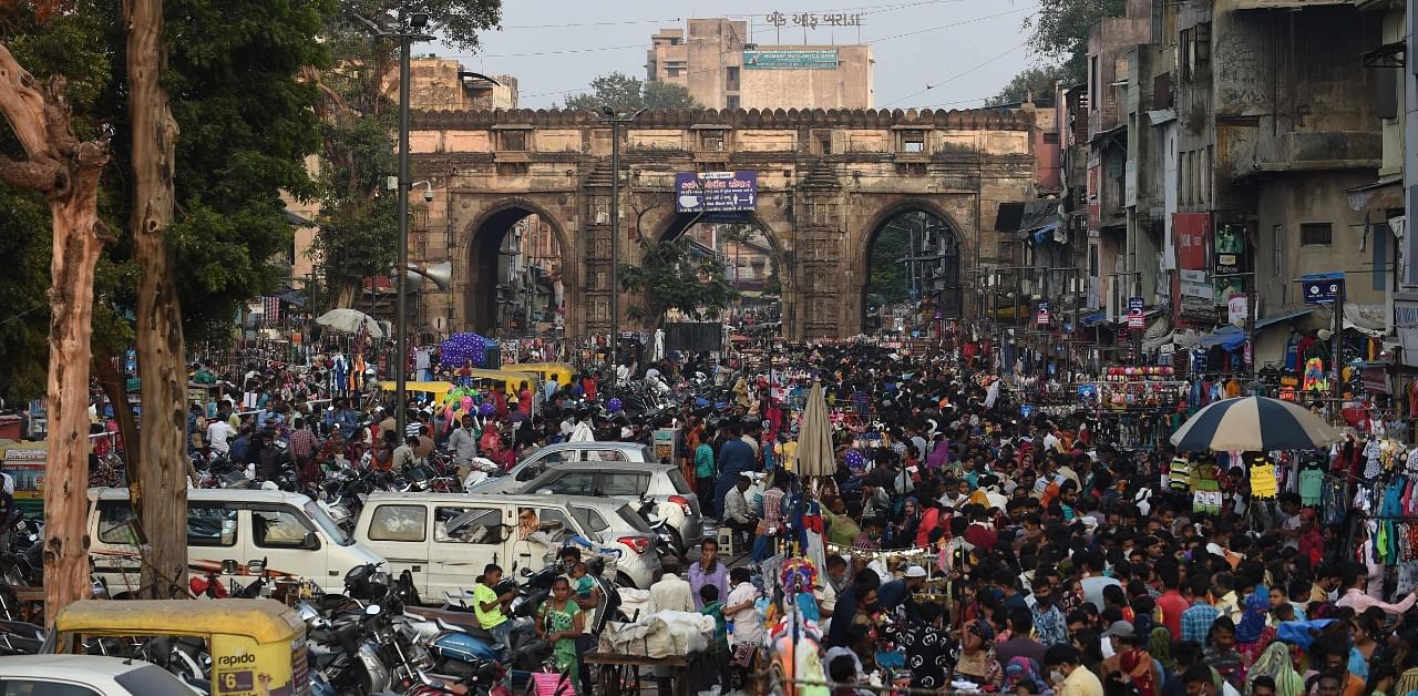 Shoppers throng a market area between Teen Darwaja and Bhadrakali Temple ahead of Diwali. Credit: AFP Photo