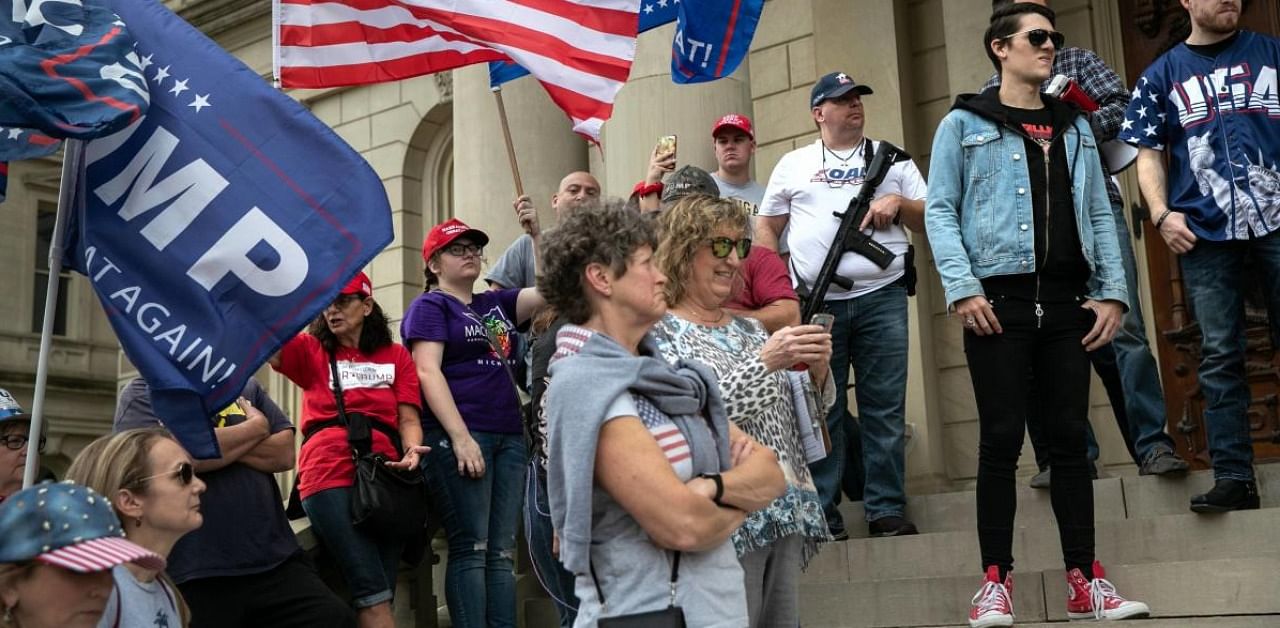 Trump supporters demonstrate at the Michigan state capitol on November 08, 2020 in Lansing, Michigan. Credit: AFP.