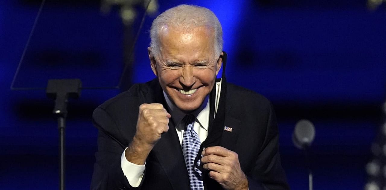 President-elect Joe Biden gestures to supporters Saturday, Nov. 7, 2020, in Wilmington. Credit: AP/PTI Photo
