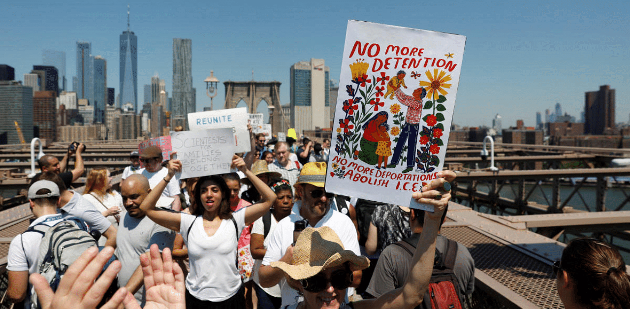 Demonstrators march on Brooklyn Bridge during "Keep Families Together" march to protest Trump administration's immigration policy in New York. Credit: Reuters Photo