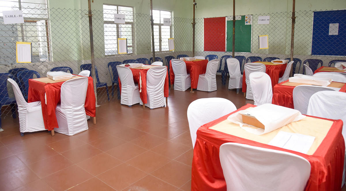 Tables set up at a school for counting of votes for RR Nagar byelection in Bengaluru on Monday. DH Photo/S K Dinesh