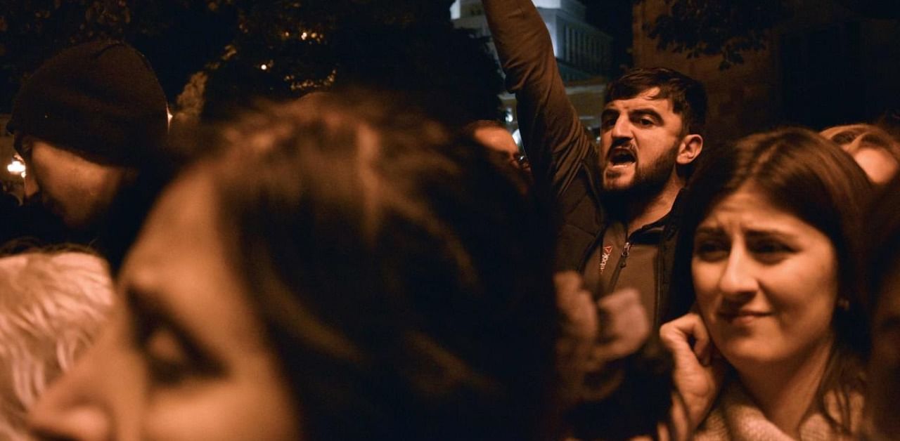 Armenians protest against the country's agreement to end fighting with Azerbaijan over the disputed Nagorno-Karabakh region outside the government headquarters in Yerevan. Credit: AFP.