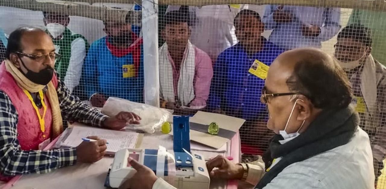 Election officials count votes at a centre on counting day of Bihar Assembly polls, in Begusarai district. Credit: PTI Photo