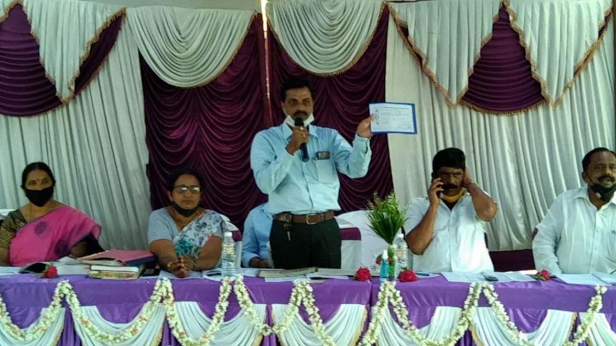 Koodumangaluru Rameshwara Primary Agriculture Credit Cooperative Society President K K Hemanth Kumar speaks during the annual meeting at Koodige.