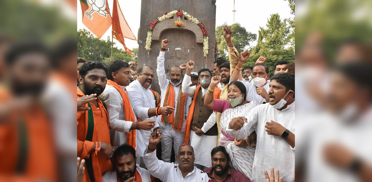 Telangana BJP President Bandi Sanjay Kumal along with party leaders celebrate the party's win in Dubbaka bypoll, in Hyderabad. Credit: PTI