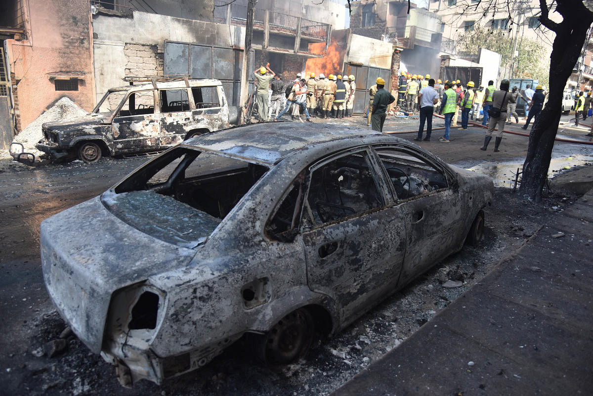 Some of the cars gutted in the blaze. DH PHOTO/JANARDHAN B K