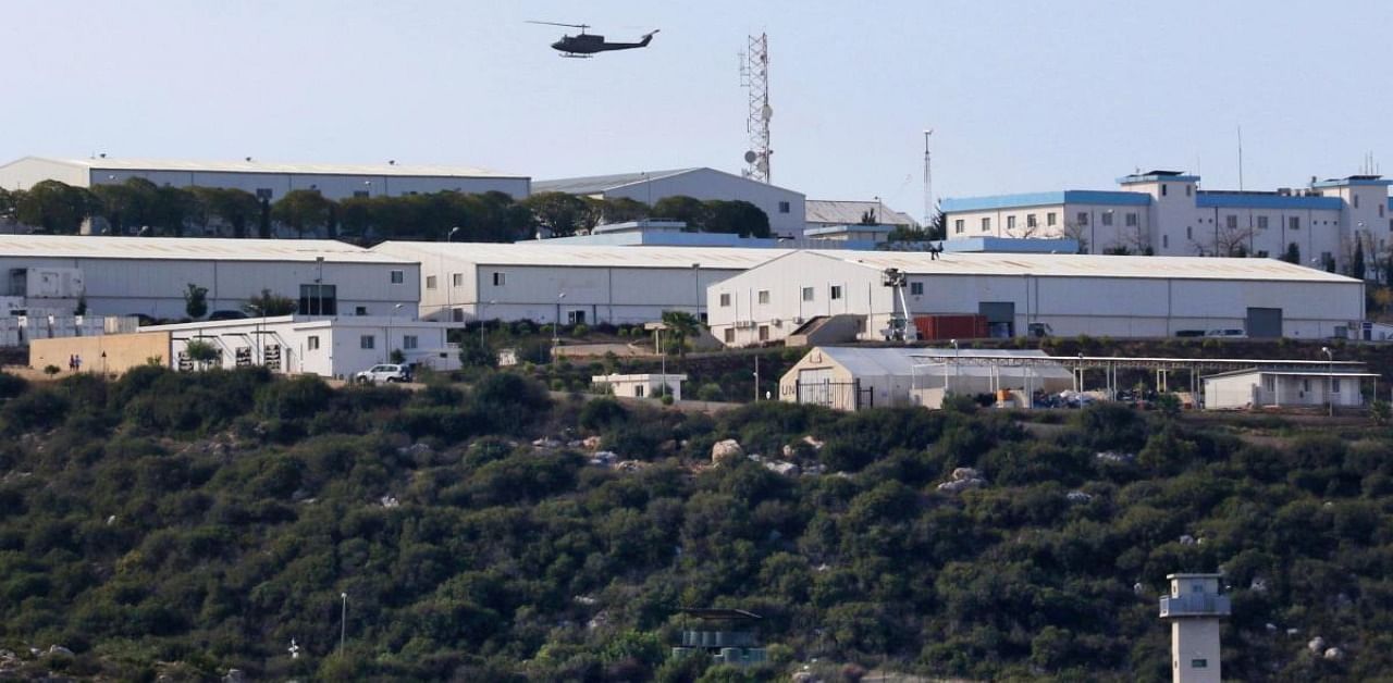 Lebanese army helicopter flying over the southern Lebanese town of Naqura, on the border with Israel. Credit: AFP