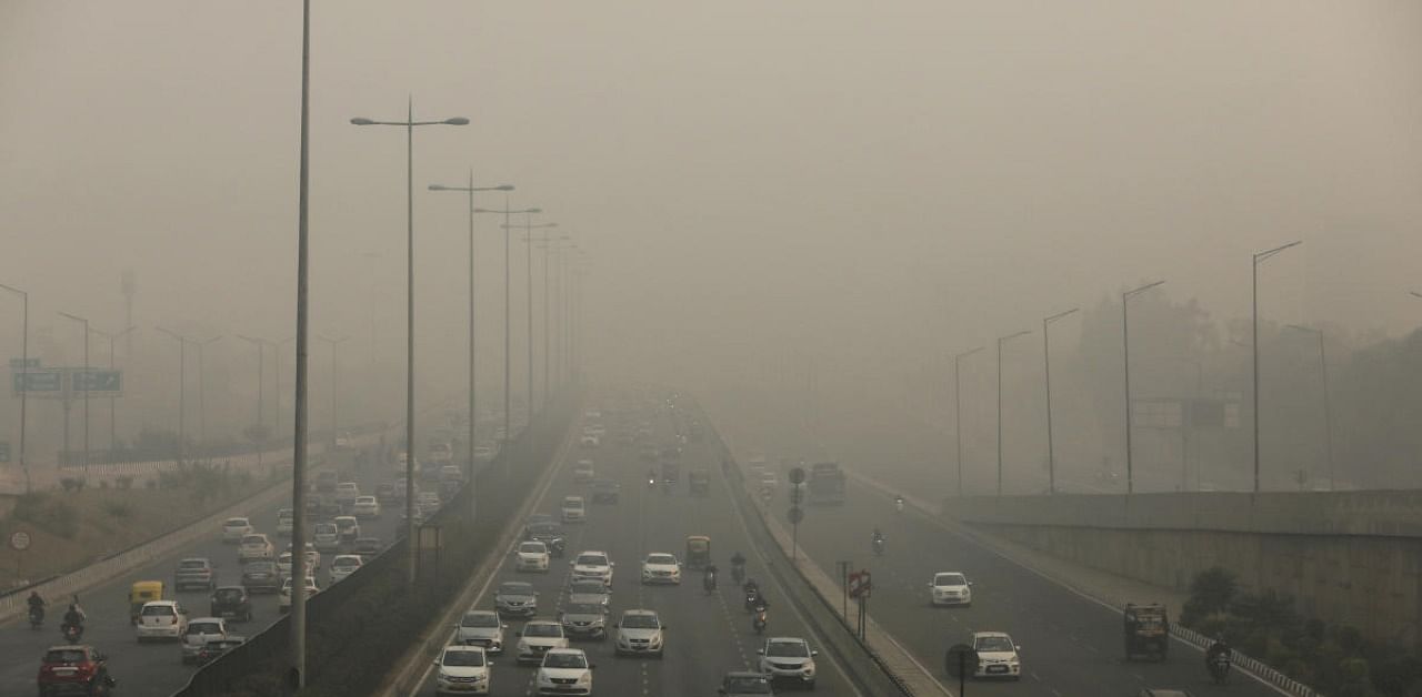 Vehicles drive through smog in Gurugram, India. Credit: Reuters