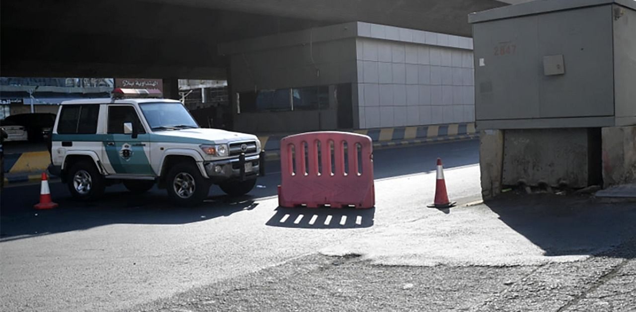 Saudi police close a street leading to a non-Muslim cemetery in the Saudi city of Jeddah where a bomb struck a World War I commemoration attended by European diplomats. Credit: AFP