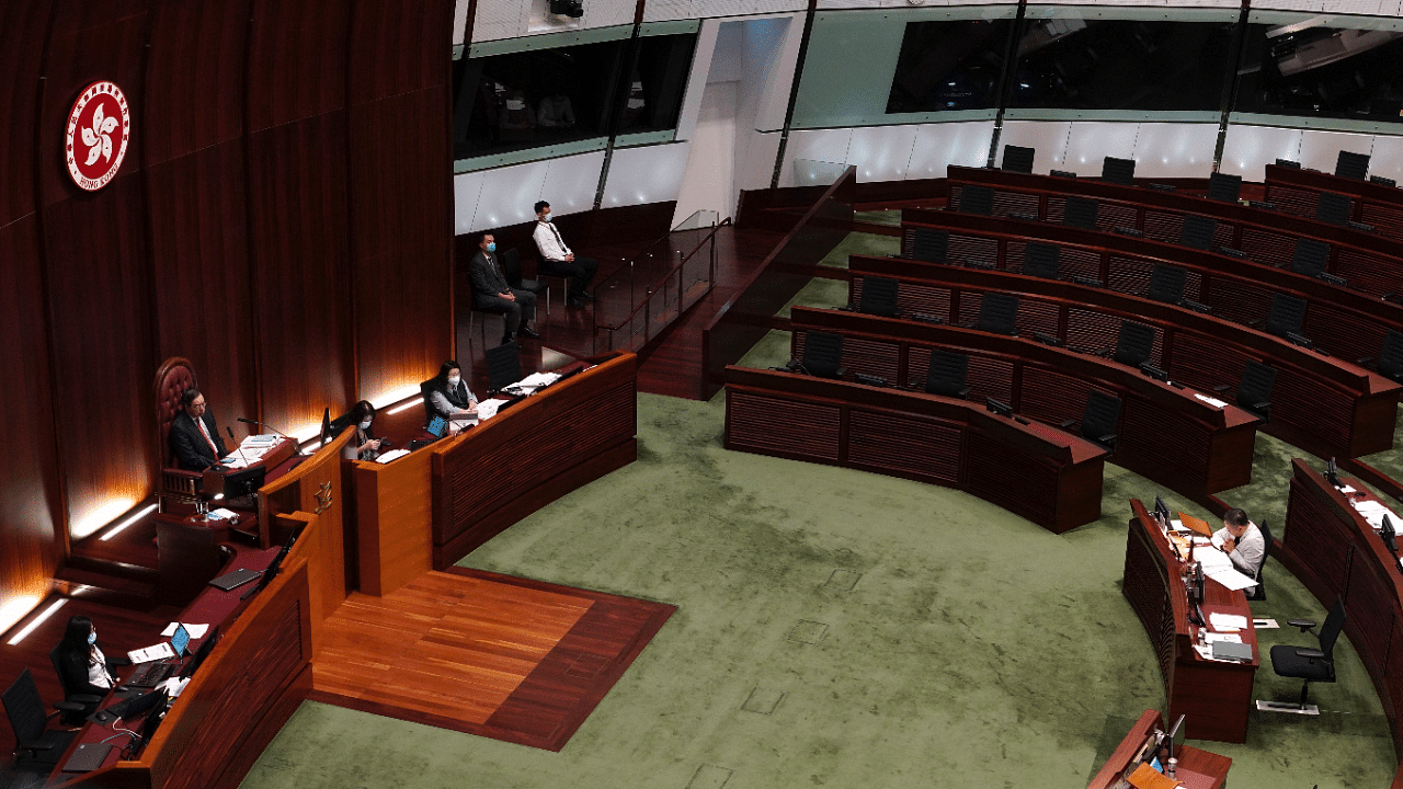 Empty seats of pro-democracy legislators, top right, are seen at Legislative Chamber in Hong Kong. Credits: AP Photo