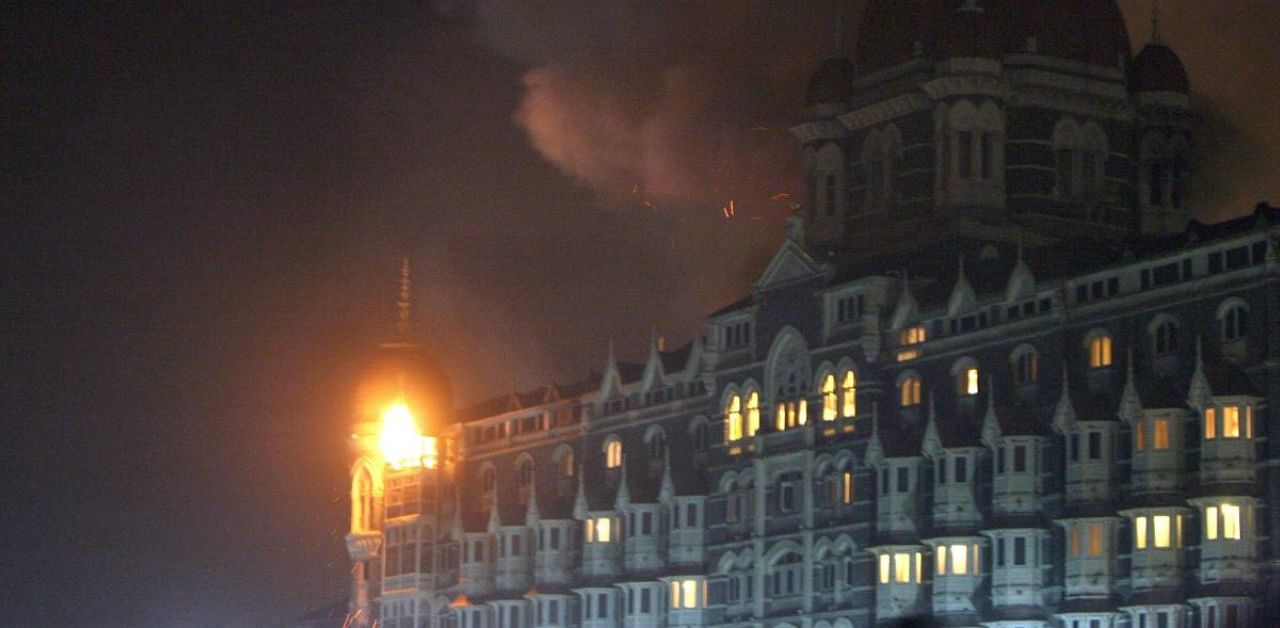 Fire and smoke is seen during an attack at the Taj Mahal Palace hotel in Mumbai. Credit: AFP