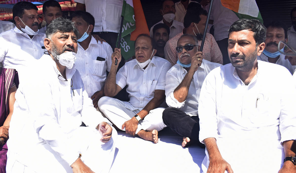 Karnataka Pradesh Congress Committee President D K Shivakumar participated in the protest against the handing over of Mangalore International Airport (MIA) to Adani Group in Kenjar, on the outskirts of Mangaluru, on Thursday. Credit: DH