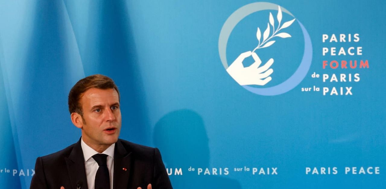 French President Emmanuel Macron gestures as he speaks during The Paris Peace Forum at The Elysee Palace in Paris. Credit: Reuters