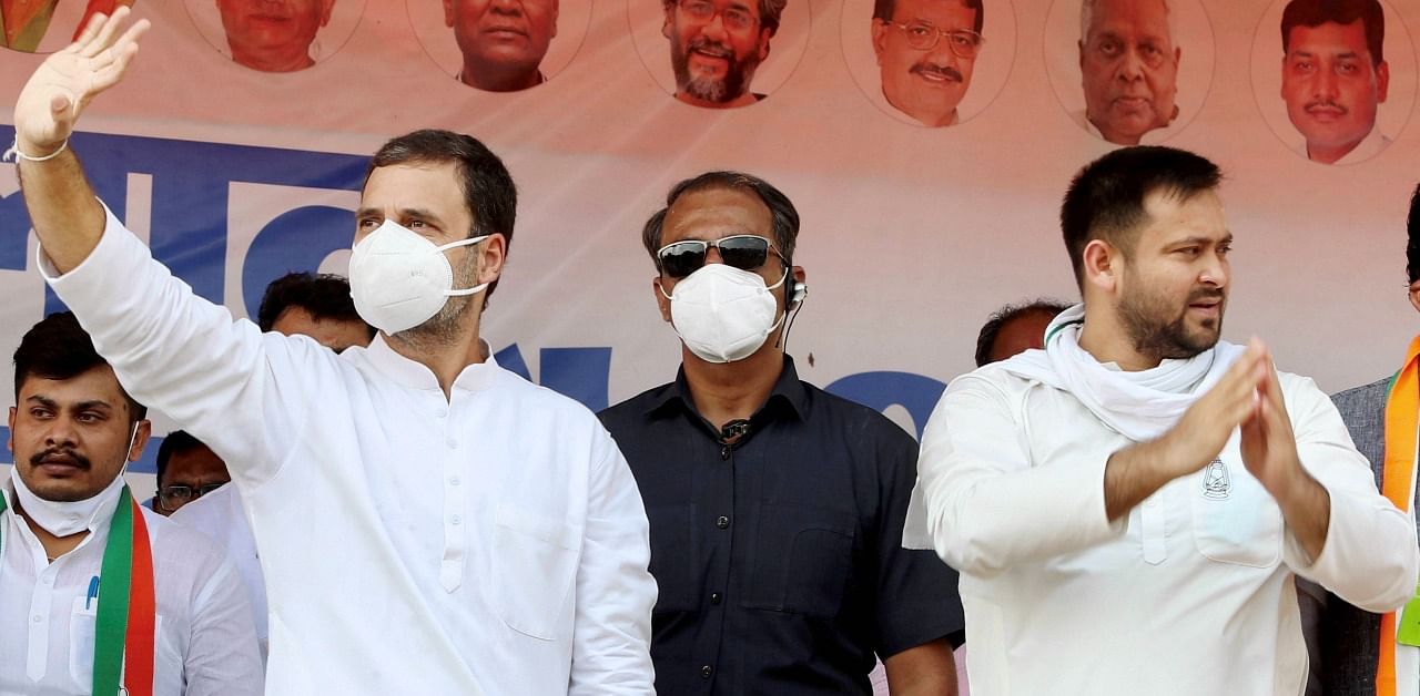 Congress leader Rahul Gandhi along with RJD leader Tejashwi Yadav. Credit: PTI Photo
