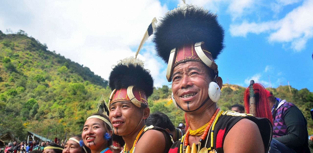 Naga tribesmen in their traditional attire during the third day of Hornbill festival at Kisama village in Kohima. Credit: PTI Photo