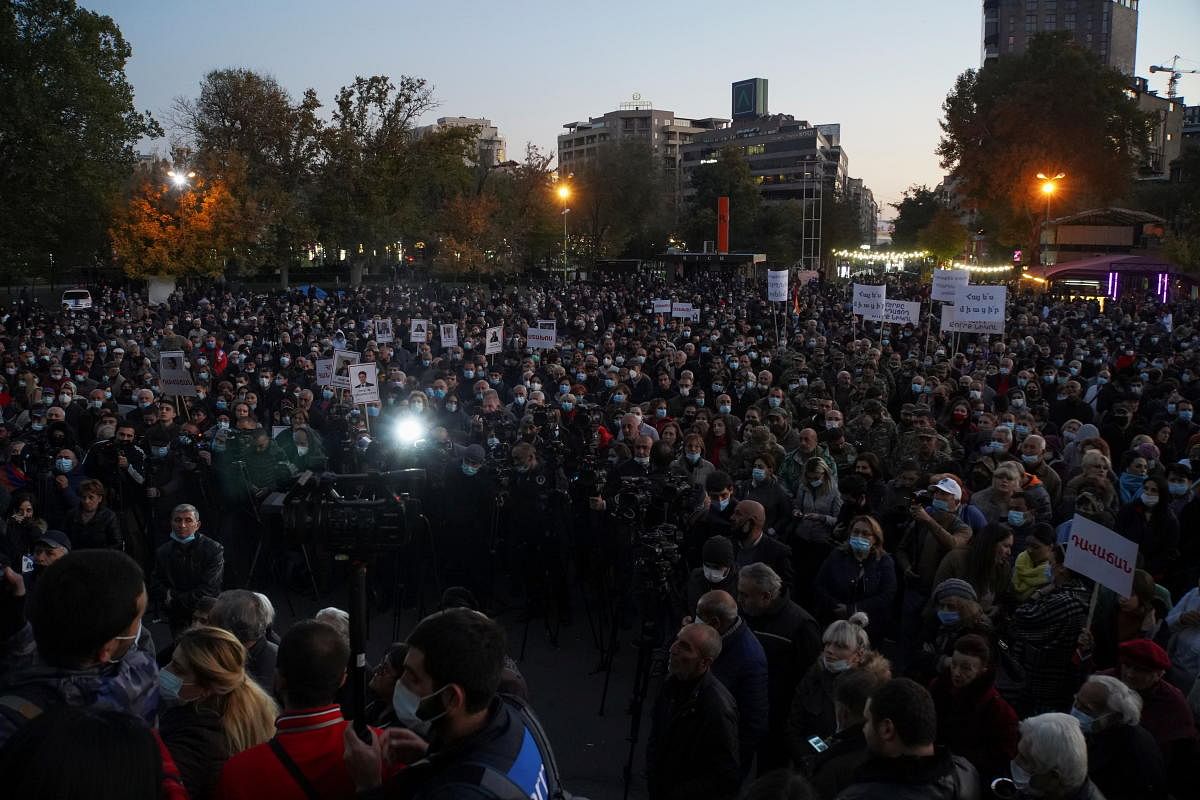 People attend an opposition rally to demand the resignation of Armenian Prime Minister Nikol Pashinyan following the signing of a deal to end the military conflict over the Nagorno-Karabakh region, in Yerevan, Armenia November 13, 2020. Credit: REUTERS