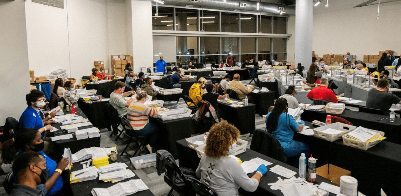 Employees of the Fulton County Board of Registration and Elections process ballots in Atlanta, Georgia US. Credit: Reuters Photo