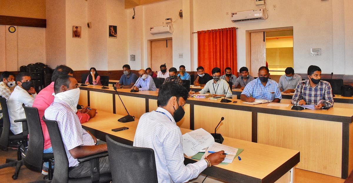 The officials at a meeting of the district-level task force at the DC’s office in Madikeri on Friday.