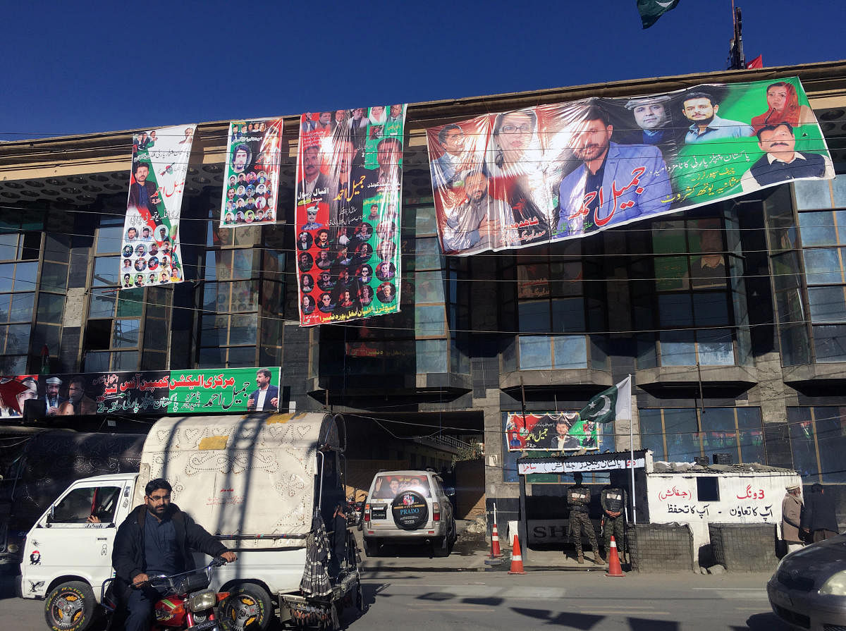 Election campaign banners of different political parties are seen on a building ahead of the legislative assembly elections in the city of Gilgit, Gilgit Baltistan, Pakistan. Credit: Reuters