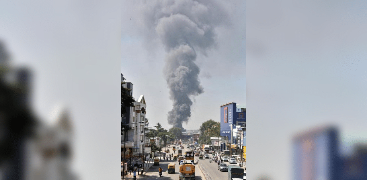 A thick cloud of smoke billows into the Mysuru Road sky on November 10 following a fire in an illegal chemical warehouse. DH PHOTO/JANARDHAN B K
