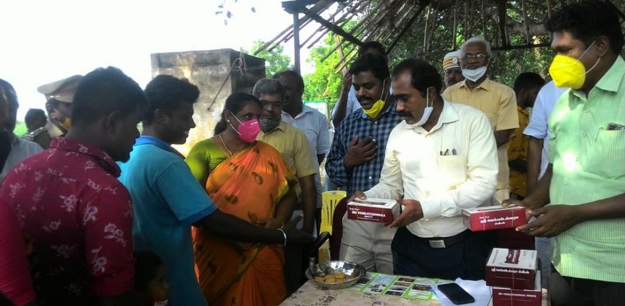 Sivaganga District Collector J Jeyakanthan distributed  sweets to residents of the three villages on Thursday. Credit: DH Photo.