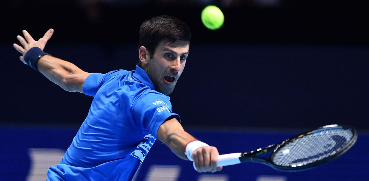 Serbia's Novak Djokovic returns against Austria's Dominic Thiem during their men's singles round-robin match on day three of the ATP World Tour Finals tennis tournament at the O2 Arena in London. Credit: AFP Photo
