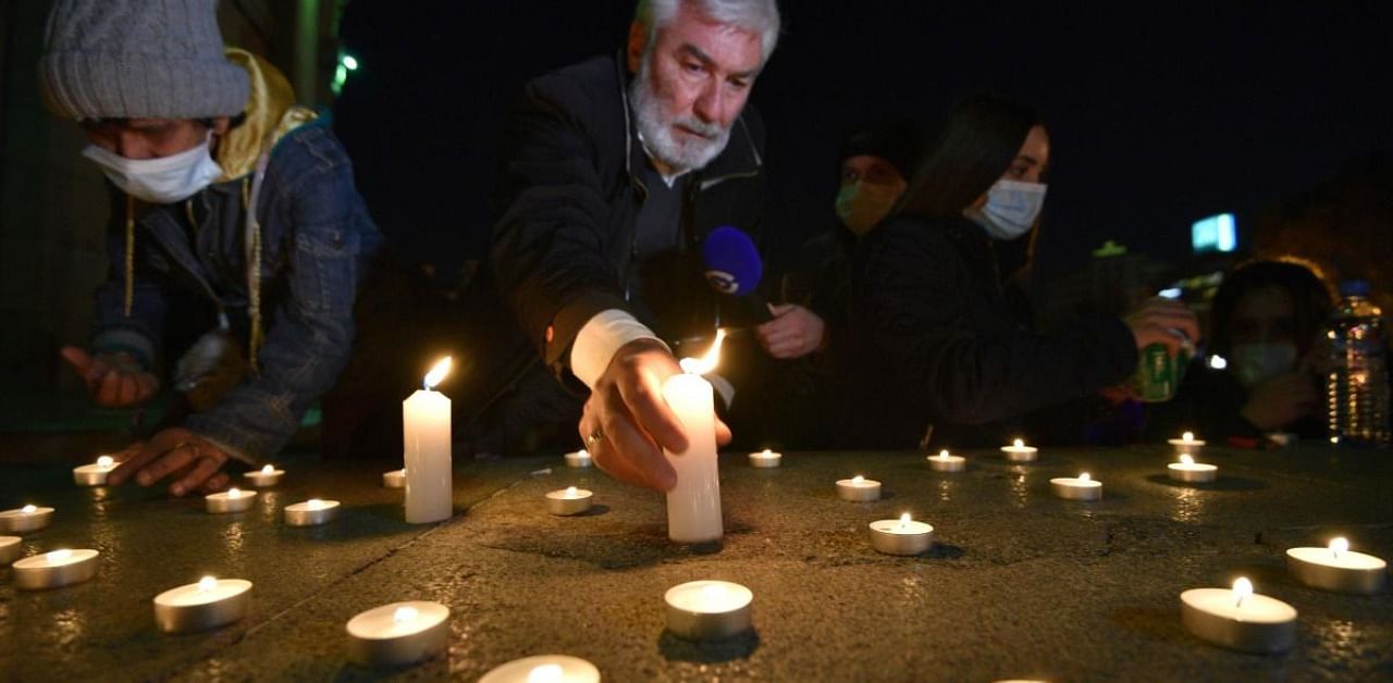 People light candles in memory of Armenian killed in the Karabakh's conflict. Credit: AFP
