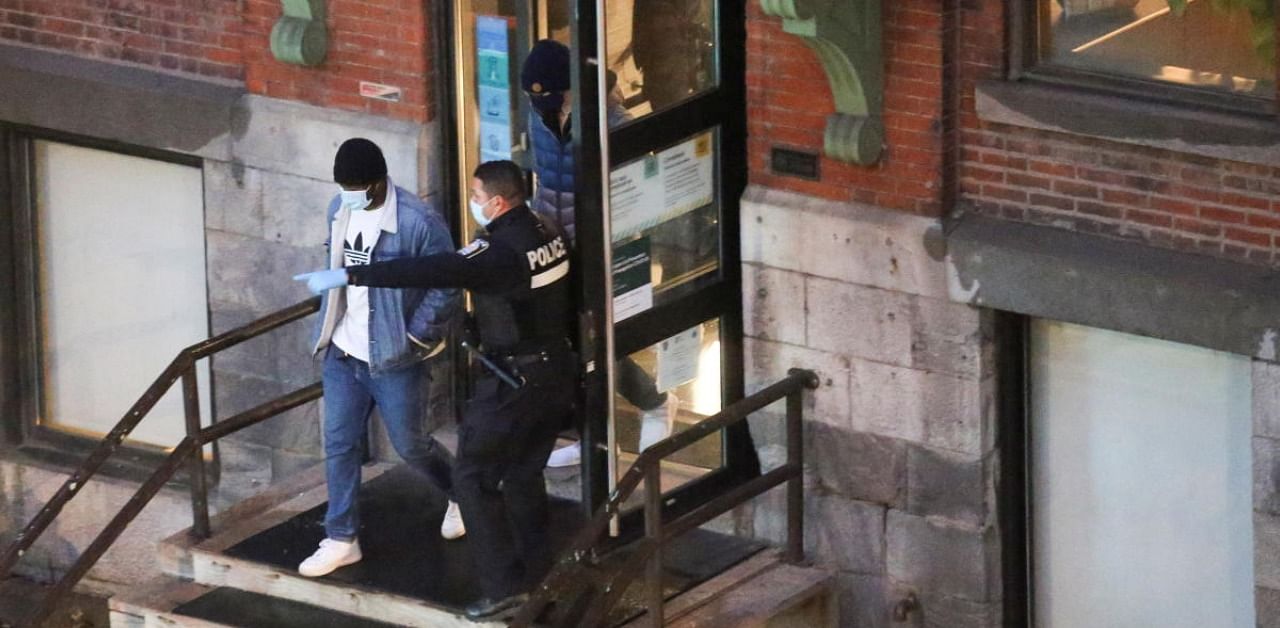 Police escort workers out of the building at gaming software developer Ubisoft in Montreal. Credit: Reuters Photo