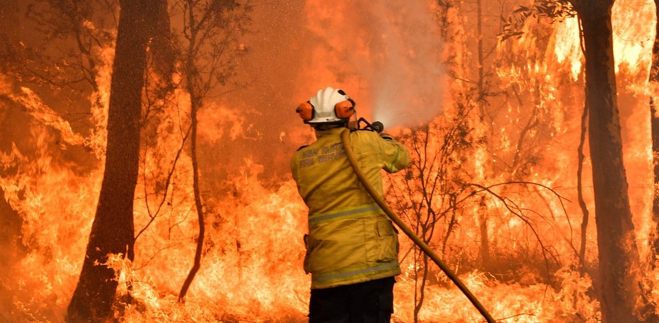 Climate change is already buffeting Australia with more extreme bushfires, droughts and cyclones -- and the fossil-fuel reliant country should brace for worse to come. Credit: AFP Photo