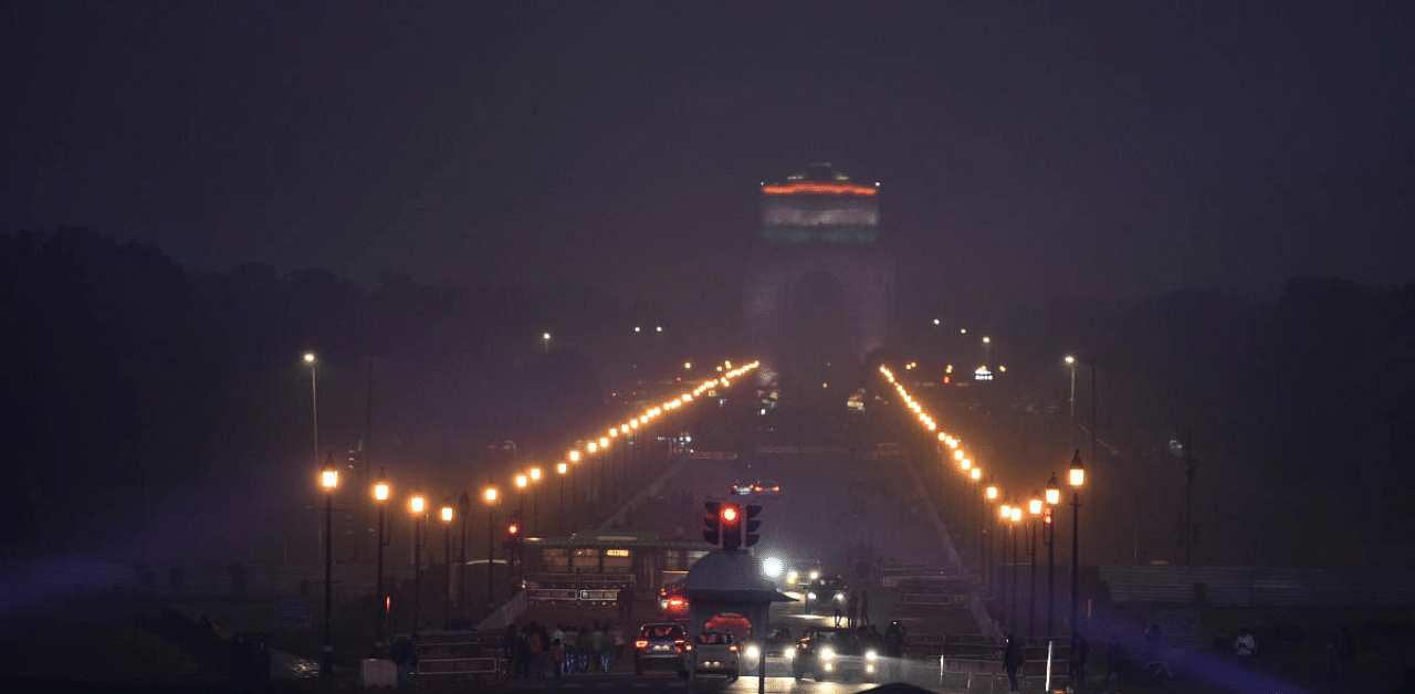 A view of India Gate during rain in New Delhi, Sunday. Credit: PTI Photo
