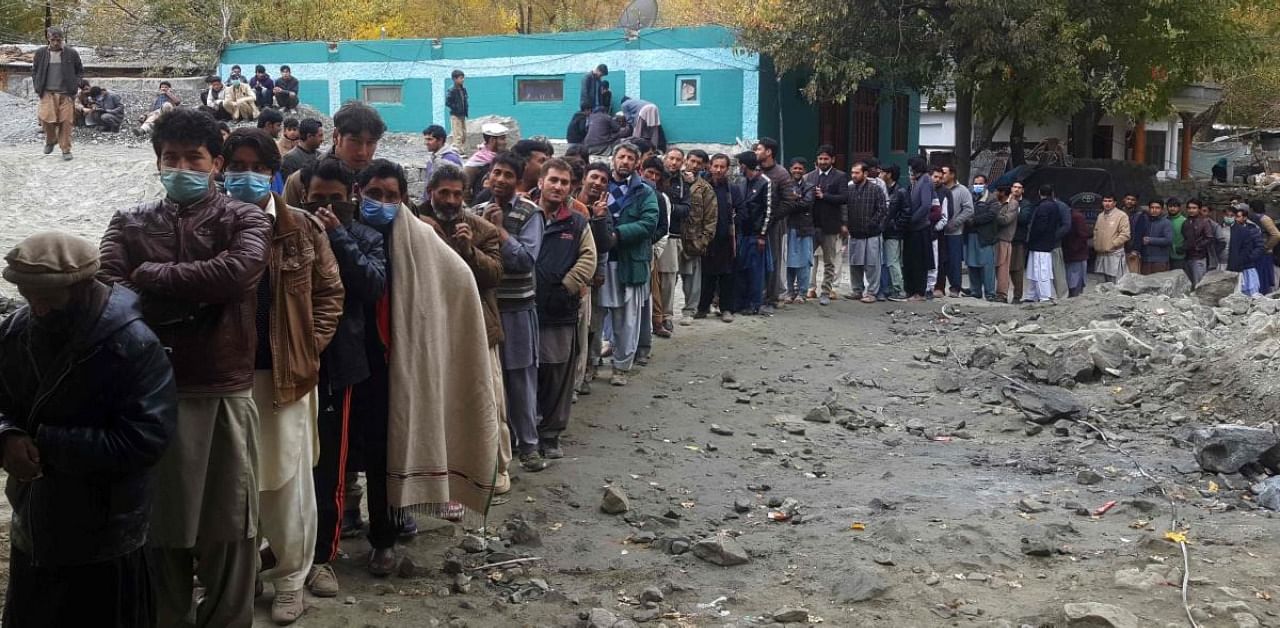 People queue to cast their ballot at a polling station during the legislative assembly election in Skardu city in Gilgit-Baltistan region of Pakistan. Credit: AFP