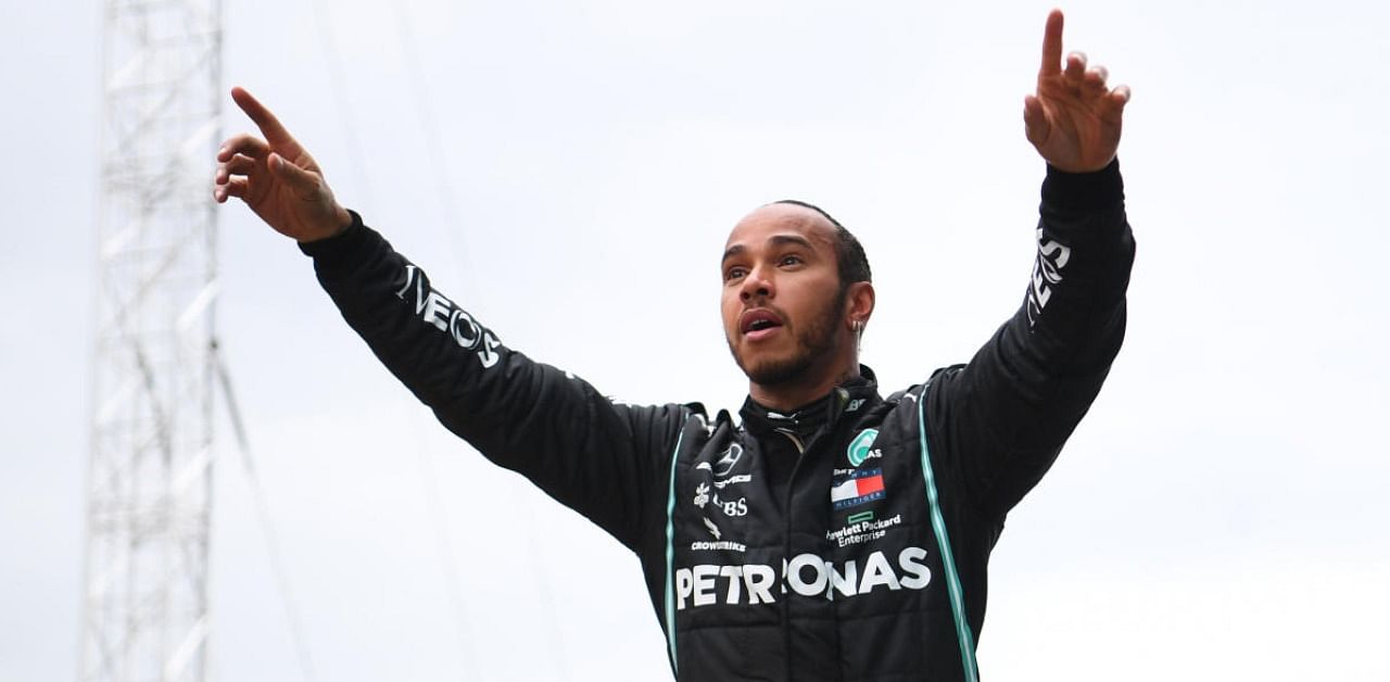 Mercedes' Lewis Hamilton celebrates after winning the Turkish Grand Prix and the world championship. Credit: Reuters.