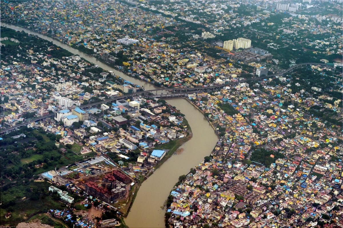 An aerial view of the Adyar River swollen due to the heavy rains, in Chennai. Credit: PTI Photo