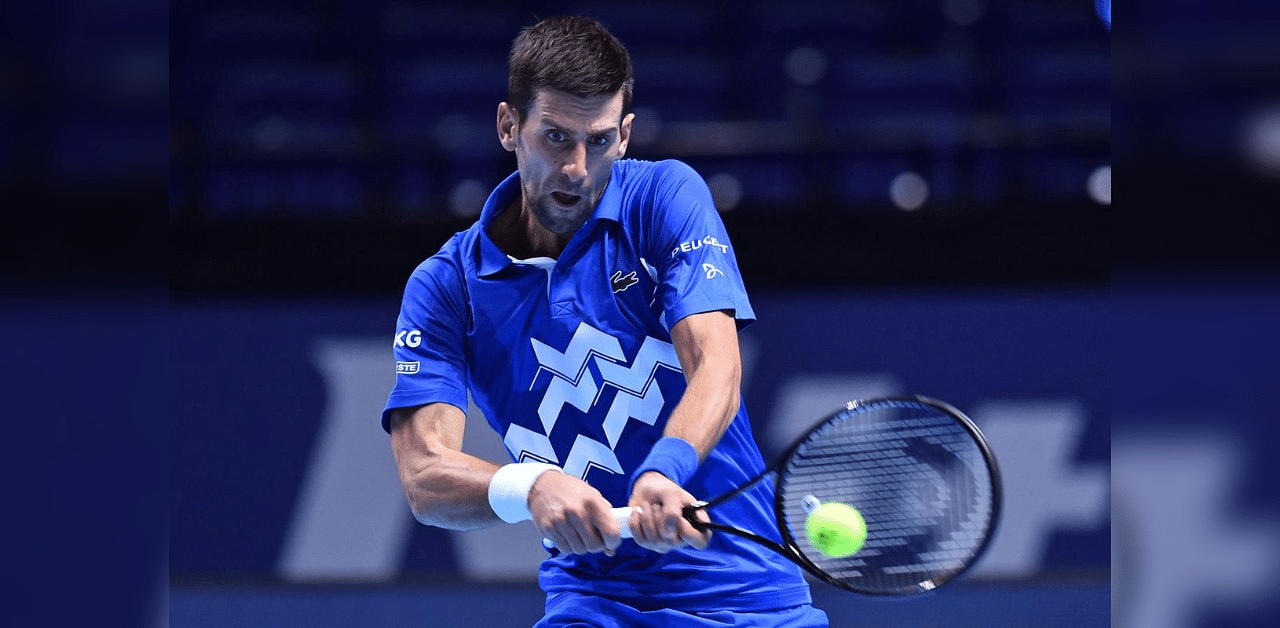 Serbia's Novak Djokovic returns against Argentina's Diego Schwartzman in their men's singles round-robin match on day two of the ATP World Tour Finals tennis tournament at the O2 Arena in London on November 16, 2020. Credit: AFP Photo