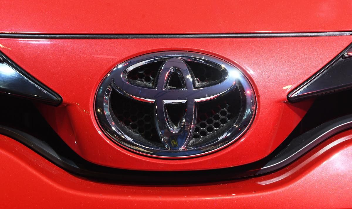 The Toyota logo is seen in the newly launched vehicle Toyota Yaris during a conference in Kolkata on May 18, 2018. Toyota Kirloskar Motors organised the event to launch in the Indian market the Toyota Yaris vehicle. The will be priced uniformly across all