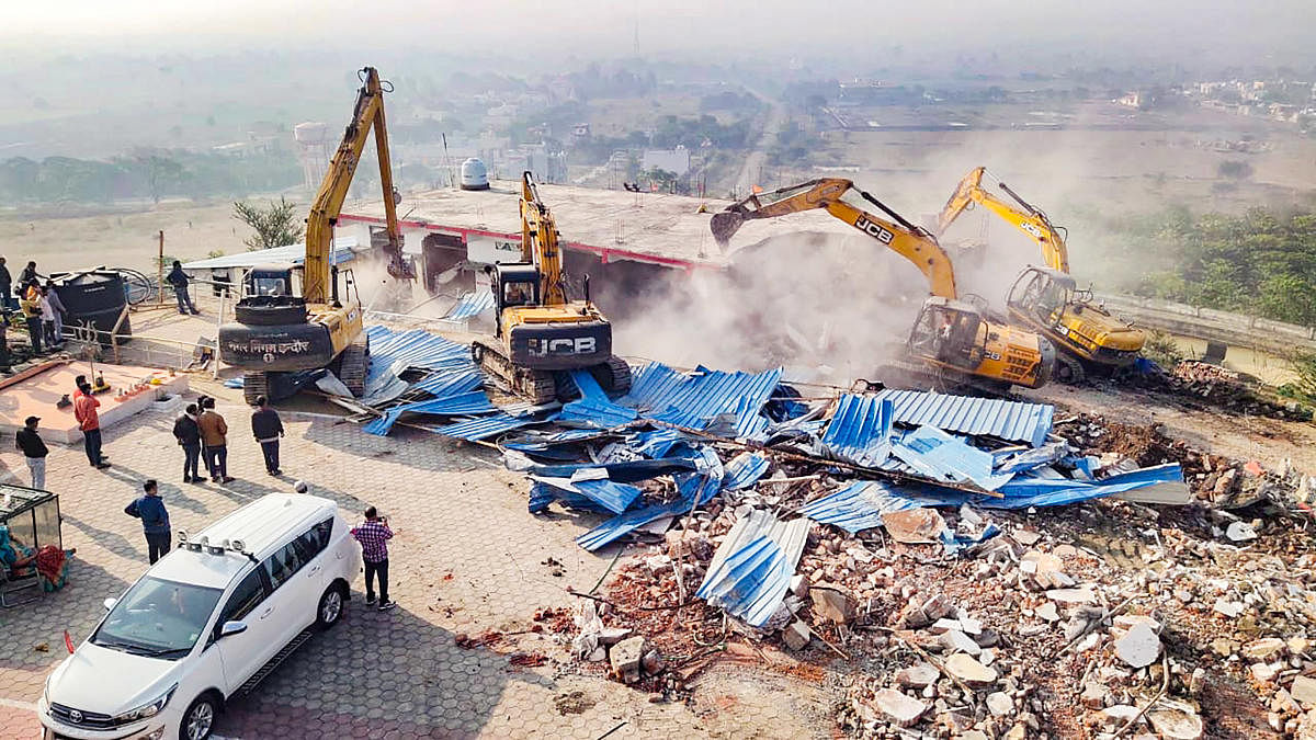 Authorities demolish an illegal construction of self-styled godman Computer Baba aka Namdev Das Tyagi, in Indore. Credit: PTI