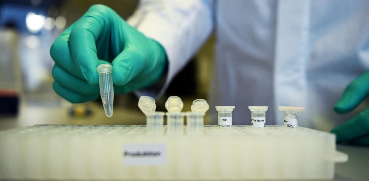 Employee Philipp Hoffmann, of German biopharmaceutical company CureVac, demonstrates research workflow on a vaccine for Covid-19 at a laboratory in Tuebingen. Credit: Reuters file photo.