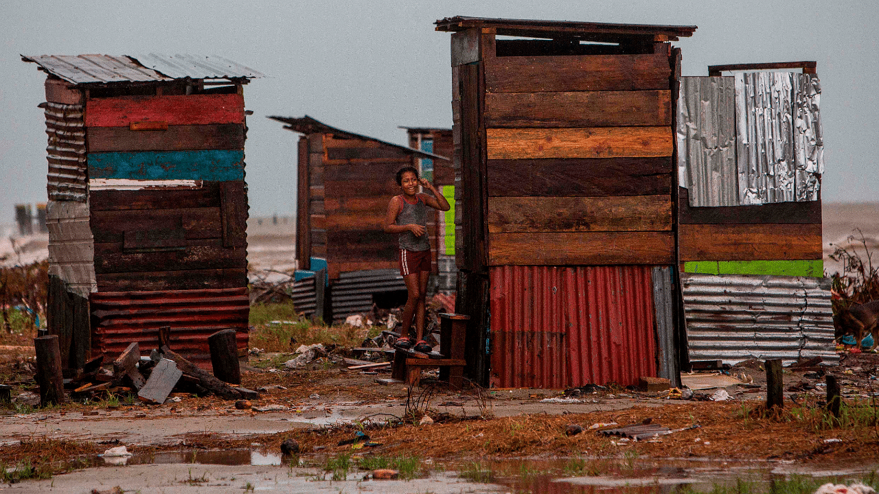 A girl is seen in a small house in front of the beach in Bilwi, Puerto Cabezas, Nicaragua. Credits: AFP Photo