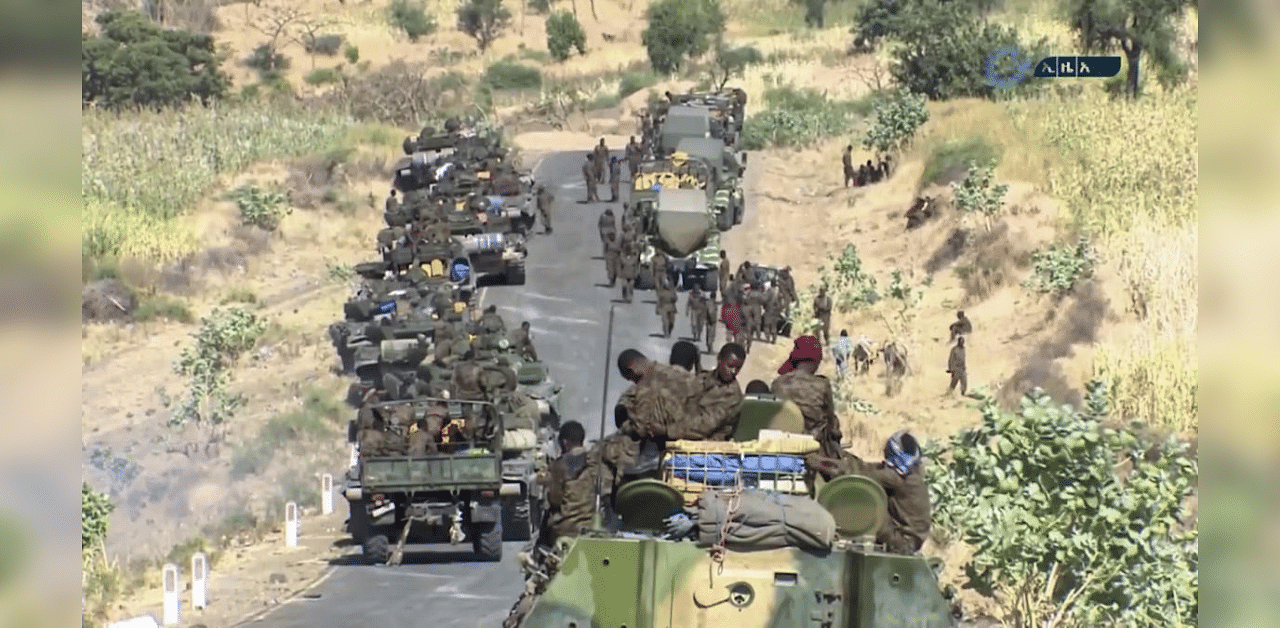  This image made from undated video released by the state-owned Ethiopian News Agency on Monday, Nov. 16, 2020 shows Ethiopian military gathered on a road in an area near the border of the Tigray and Amhara regions of Ethiopia. Credit: AP Photo