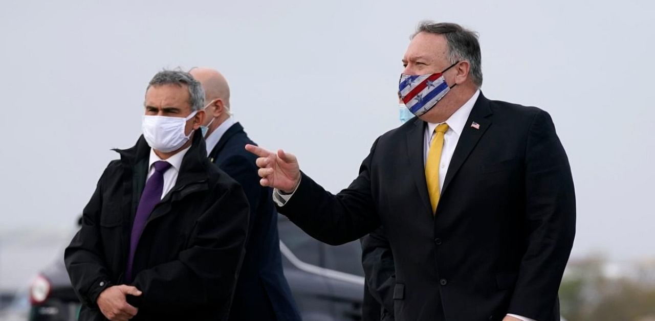 US Secretary of State Mike Pompeo (R) prepares to board a plane at Paris Le Bourget Airport in Le Bourget. Credit: AFP Photo
