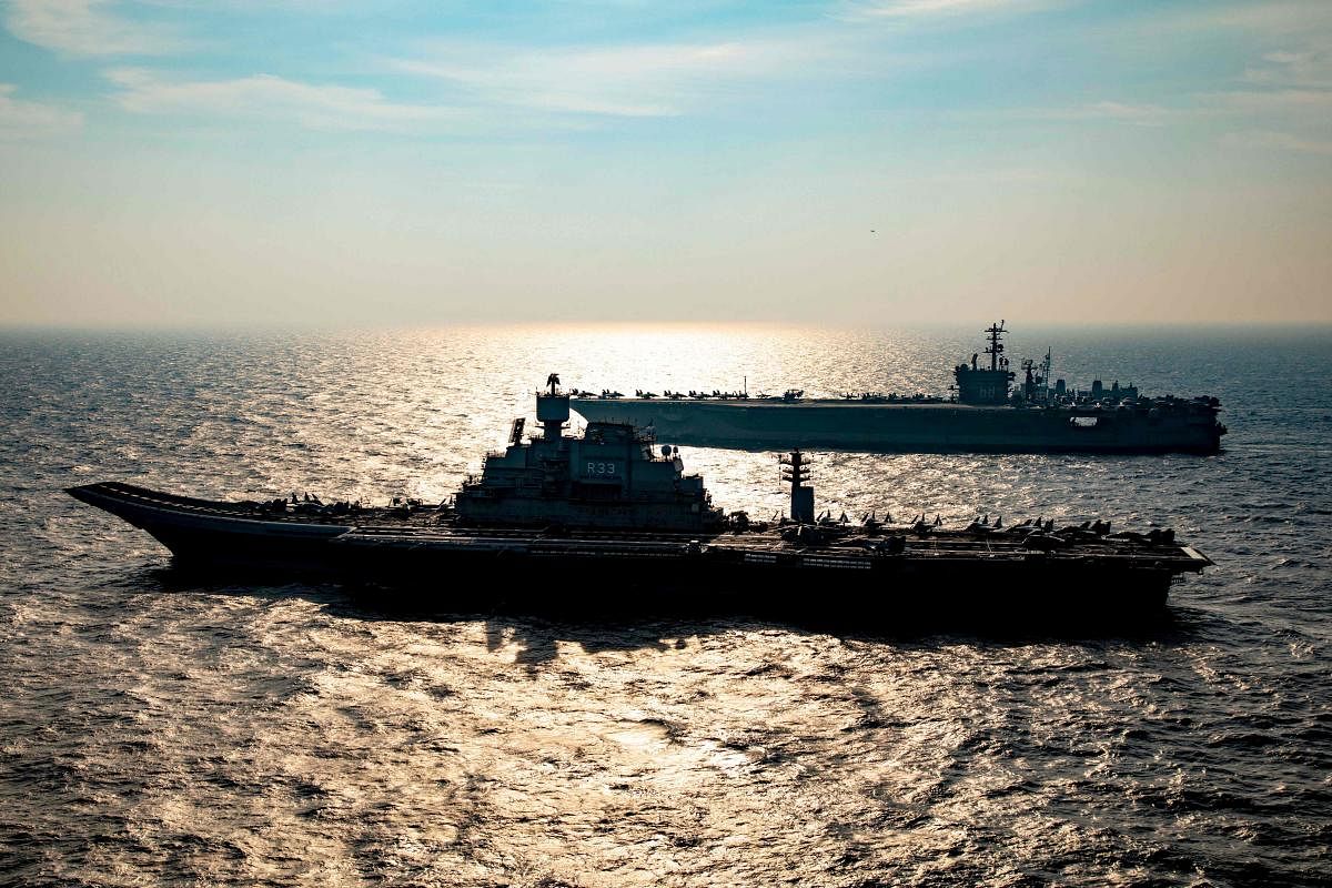 This handout photo taken and released by the Indian Navy on November 17, 2020 shows a ships taking part in the second phase of the Malabar naval exercise in the Arabian sea. Credit: AFP