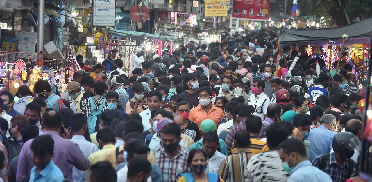 Shoppers visit a crowded Chandni Chowk market during 'Dhanteras' on the eve of 'Diwali' and Kali Puja, amid the ongoing coronavirus pandemic, in Kolkata. Credit: PTI Photo