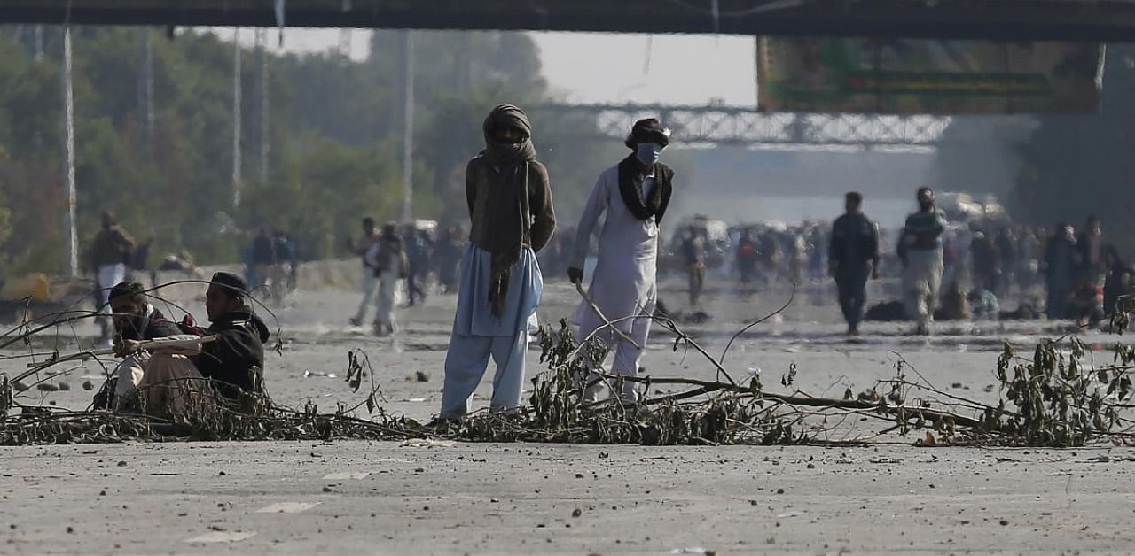 Supporters of 'Tehreek-e-Labaik Pakistan, a religious political party, block a main road during an anti-France rally in Islamabad. Credit: AFP.